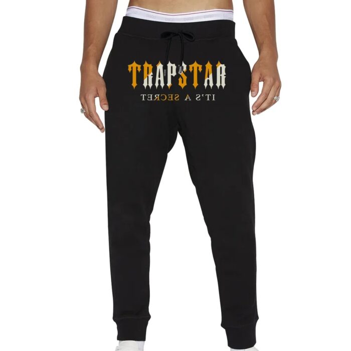 "Trapstar It's a Secret Streetwear Black Pants - Unleash the urban edge with these sleek and versatile black pants from Trapstar's exclusive streetwear collection."