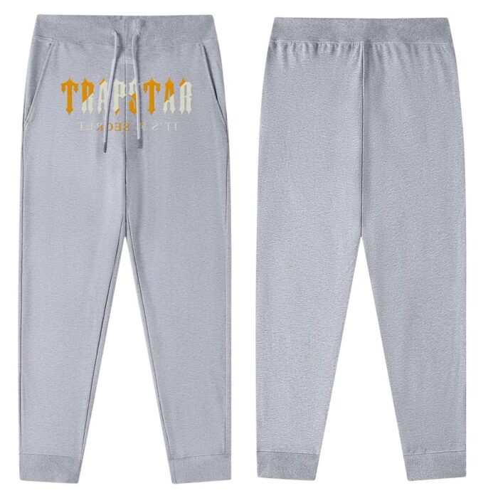 "Trapstar It’s a Secret Streetwear Gray Joggers - Elevate your street style with these comfortable and trendy gray joggers from Trapstar's It’s a Secret collection."